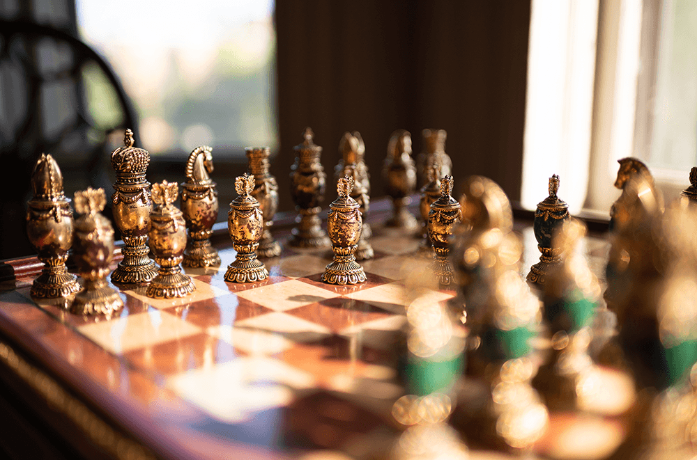 A close-up of a beautifully crafted ornate chess set.